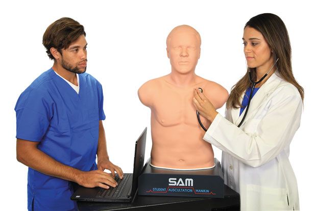 two students train on SAM 3G® Auscultation Trainer 